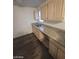 A kitchen features granite counters, stainless steel sink, and neutral cabinets at 555 E Silverado Ranch Blvd # 1123, Las Vegas, NV 89183