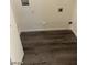 Laundry room with utility connections and durable wood-style flooring at 555 E Silverado Ranch Blvd # 1123, Las Vegas, NV 89183