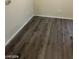 Neutral-toned walls and wood laminate flooring add to this unfurnished living area at 555 E Silverado Ranch Blvd # 1123, Las Vegas, NV 89183
