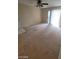 Bright living room with a ceiling fan, sliding glass door, and carpeted floors at 555 E Silverado Ranch Blvd # 1123, Las Vegas, NV 89183