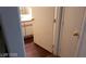 View of a bathroom with a wooden floor and a white vanity with a mirror at 5750 E Hacienda Ave # 202, Las Vegas, NV 89122