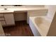 Bathroom featuring a sink, bathtub, and vanity area with stylish flooring at 5750 E Hacienda Ave # 202, Las Vegas, NV 89122