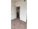 Bedroom featuring neutral walls, carpeted flooring, and an open door at 5750 E Hacienda Ave # 202, Las Vegas, NV 89122