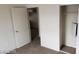 Bedroom featuring neutral walls, carpeted flooring, and an open door at 5750 E Hacienda Ave # 202, Las Vegas, NV 89122