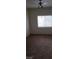 Bedroom featuring carpet and a ceiling fan with light, and a bright window at 5750 E Hacienda Ave # 202, Las Vegas, NV 89122