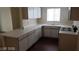 Kitchen featuring sleek countertops and white cabinetry at 5750 E Hacienda Ave # 202, Las Vegas, NV 89122