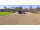 Large backyard with an artificial turf area, a fire pit, and a trampoline at 6017 Montecito Way, Las Vegas, NV 89108