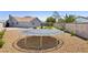Wide angle of a backyard featuring a trampoline, a play structure, and a seating area at 6017 Montecito Way, Las Vegas, NV 89108