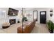 Comfortable living room featuring a brick fireplace, TV, and stylish decor at 6017 Montecito Way, Las Vegas, NV 89108
