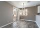 Dining Room with Sliding Door and modern lighting at 6873 Tamarus St # 201, Las Vegas, NV 89119