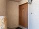 Apartment entrance with a brown door numbered 201 at 6873 Tamarus St # 201, Las Vegas, NV 89119