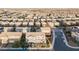 Wonderful aerial view of a residential neighborhood with a playground and many homes at 7002 Fossil Rim St, North Las Vegas, NV 89084