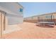 Spacious backyard with gravel landscaping and a trampoline at 7002 Fossil Rim St, North Las Vegas, NV 89084