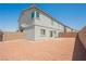 Low-maintenance backyard features a patio area and privacy fencing at 7002 Fossil Rim St, North Las Vegas, NV 89084