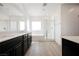 Bright bathroom featuring double sinks, bathtub and glass enclosed shower at 7002 Fossil Rim St, North Las Vegas, NV 89084