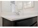 Bathroom vanity with modern fixtures and a white countertop at 7002 Fossil Rim St, North Las Vegas, NV 89084