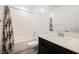 Bathroom featuring a shower and tub combination with a modern vanity at 7002 Fossil Rim St, North Las Vegas, NV 89084