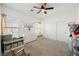 Bright bedroom with a ceiling fan, a dresser, and a closet at 7002 Fossil Rim St, North Las Vegas, NV 89084