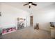 Bright bedroom with a ceiling fan and storage at 7002 Fossil Rim St, North Las Vegas, NV 89084
