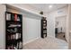 Bonus room with carpet and shelves perfect for study and storage at 7002 Fossil Rim St, North Las Vegas, NV 89084
