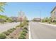Wide shot of the community entrance with a guard station at 7002 Fossil Rim St, North Las Vegas, NV 89084