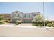 Beautiful two-story home featuring an attached two-car garage and well-maintained front yard landscaping at 7002 Fossil Rim St, North Las Vegas, NV 89084
