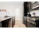 Kitchen with a view of the island, cabinets, stainless steel appliances and countertop at 7002 Fossil Rim St, North Las Vegas, NV 89084