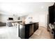 Spacious open-concept kitchen with island, connecting seamlessly to the living area at 7002 Fossil Rim St, North Las Vegas, NV 89084
