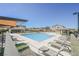Community pool area with lounge chairs and shaded seating for relaxation and enjoyment at 7002 Fossil Rim St, North Las Vegas, NV 89084