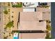 Aerial shot of the rooftop and backyard of a desert house with an RV parked in the extra long driveway at 7265 Southern Magnolia St, Las Vegas, NV 89149