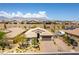 Aerial view of a well-maintained property with lush landscaping and a spacious driveway at 7265 Southern Magnolia St, Las Vegas, NV 89149