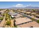 Overhead view of houses with solar panels, a long driveway with parked RV, and views of distant mountains at 7265 Southern Magnolia St, Las Vegas, NV 89149