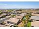 Expansive aerial view of the properties featuring multiple homes, many with backyard pools, and an RV parked in the lot at 7265 Southern Magnolia St, Las Vegas, NV 89149