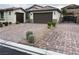 Charming single-story home featuring a three-car garage and beautifully paved driveway at 7265 Southern Magnolia St, Las Vegas, NV 89149
