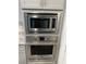 Stainless steel Frigidaire microwave and oven built into gray kitchen cabinetry at 7265 Southern Magnolia St, Las Vegas, NV 89149