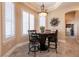 Breakfast nook with a round table, comfortable seating, and large windows with plantation shutters at 7718 Willow Cove Cir, Las Vegas, NV 89129