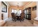 Dining area featuring elegant furniture and a decorative hutch at 7718 Willow Cove Cir, Las Vegas, NV 89129