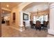 Formal dining room with decorative pillars and large chandelier at 7718 Willow Cove Cir, Las Vegas, NV 89129
