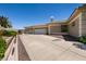 Long driveway leading to a three-car garage at 7718 Willow Cove Cir, Las Vegas, NV 89129