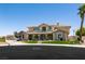 Charming two-story home featuring manicured lawn and mature palm trees at 7718 Willow Cove Cir, Las Vegas, NV 89129