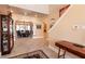 Elegant foyer with tiled floors leading to the dining room at 7718 Willow Cove Cir, Las Vegas, NV 89129