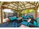 Cozy backyard gazebo featuring comfortable seating, creating an inviting outdoor lounge area for relaxation at 7718 Willow Cove Cir, Las Vegas, NV 89129