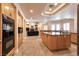 Open kitchen with an island and a view to the living room at 7718 Willow Cove Cir, Las Vegas, NV 89129