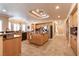Open kitchen boasts an island, stainless steel appliances, tile floors, and recessed lighting at 7718 Willow Cove Cir, Las Vegas, NV 89129