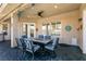 Covered patio with stylish outdoor dining area, ceiling fan, and recessed lighting, perfect for entertaining at 7718 Willow Cove Cir, Las Vegas, NV 89129