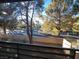 View from the balcony shows desert landscaping, trees and the community at 7730 Secret Shore Dr # 207, Las Vegas, NV 89128