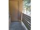 Exterior balcony featuring a door, stucco walls, and wrought iron railing at 7730 Secret Shore Dr # 207, Las Vegas, NV 89128