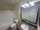 Full bathroom with granite countertops, shower-tub combo and tile floors at 7730 Secret Shore Dr # 207, Las Vegas, NV 89128