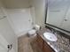 Bright bathroom with granite countertops, modern vanity and tile floors at 7730 Secret Shore Dr # 207, Las Vegas, NV 89128