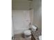 Cozy bathroom featuring a granite countertop vanity, toilet and shower tub at 7730 Secret Shore Dr # 207, Las Vegas, NV 89128